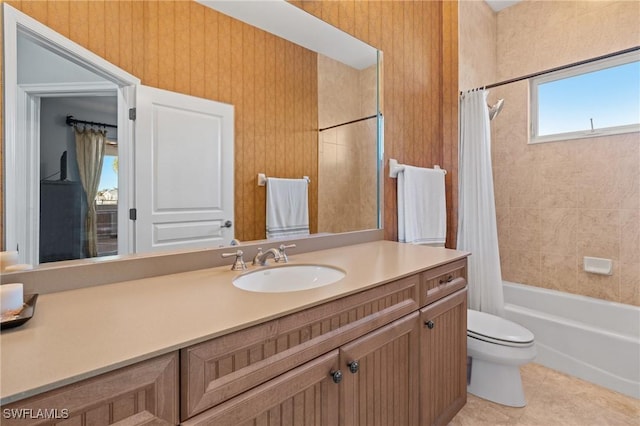 full bathroom with tile patterned floors, vanity, toilet, and shower / bathtub combination with curtain