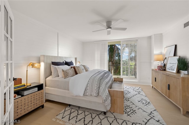 bedroom with ceiling fan and light hardwood / wood-style flooring