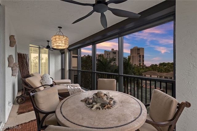 sunroom featuring a notable chandelier