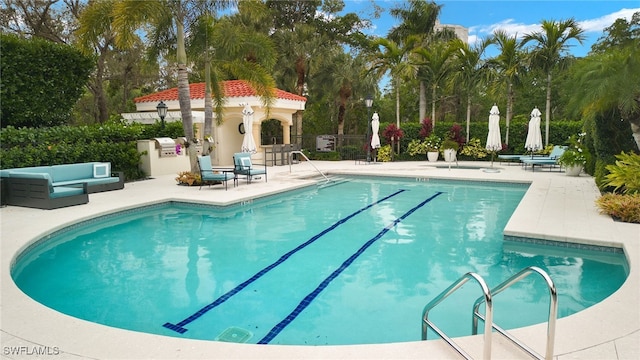 view of swimming pool with a patio area