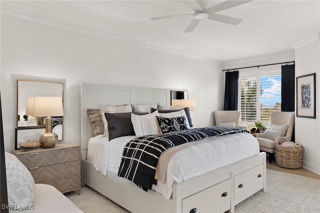 bedroom with ceiling fan and crown molding