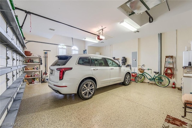 garage featuring electric panel and a garage door opener