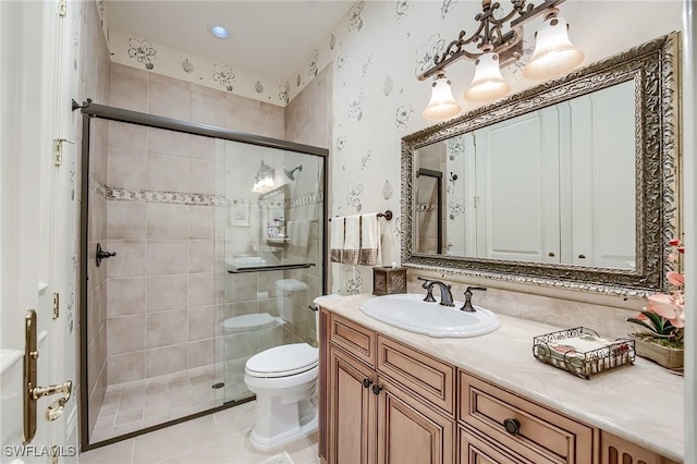 bathroom featuring tile patterned floors, vanity, toilet, and walk in shower