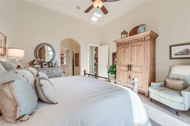 bedroom with ceiling fan, carpet floors, and connected bathroom