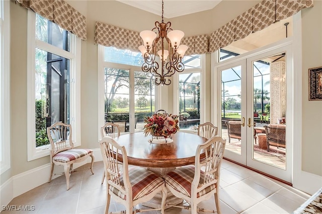 sunroom / solarium with an inviting chandelier and french doors