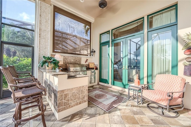 sunroom / solarium with ceiling fan