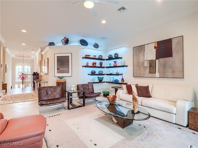 living room with crown molding, light tile patterned floors, and ceiling fan with notable chandelier