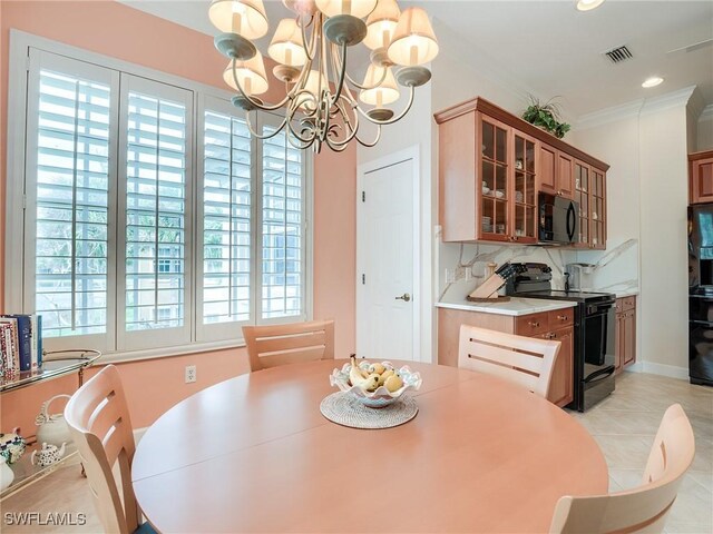 dining space featuring a notable chandelier, light tile patterned flooring, and ornamental molding