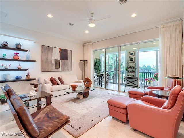 living room with light tile patterned flooring, ornamental molding, and ceiling fan