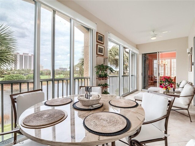 sunroom with ceiling fan and plenty of natural light