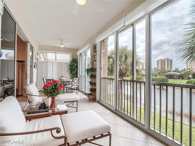 23790 Merano Ct Unit 202, Estero, FL 34134 - sunroom / solarium featuring a ceiling fan, tile patterned flooring, and a water view