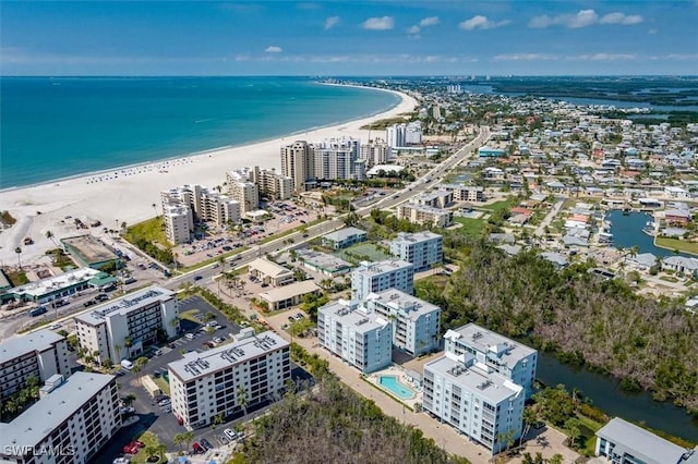 birds eye view of property featuring a view of the beach and a water view