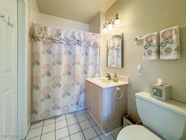 bathroom with tile patterned floors, vanity, toilet, and a shower with curtain