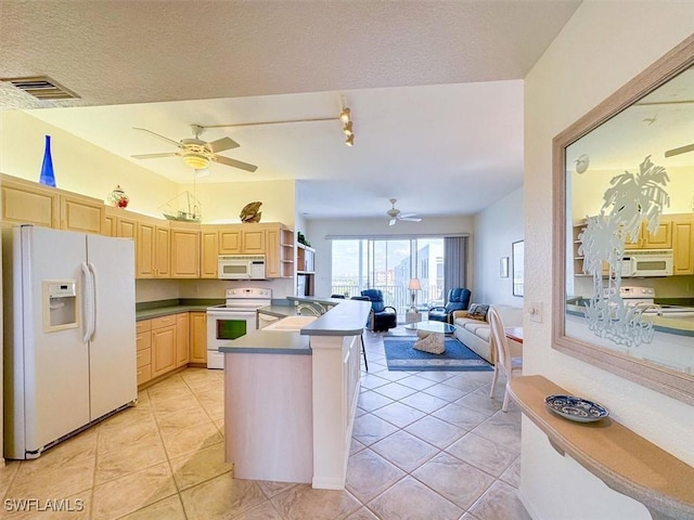 kitchen featuring ceiling fan, light brown cabinets, white appliances, and light tile patterned floors