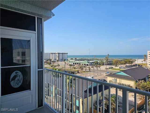 balcony featuring a water view