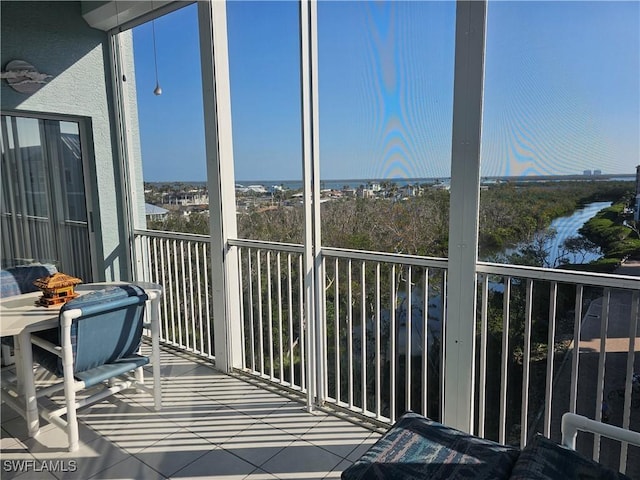 balcony featuring a water view