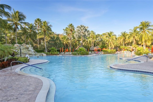 9067 Capistrano St N Unit 4502, Naples, FL 34113 - view of swimming pool featuring a patio