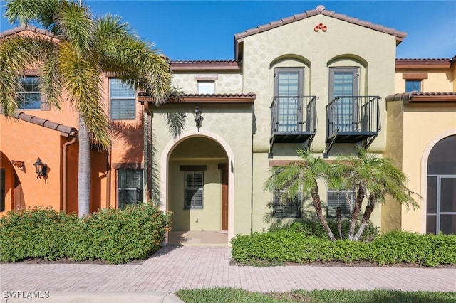 mediterranean / spanish-style house with a balcony