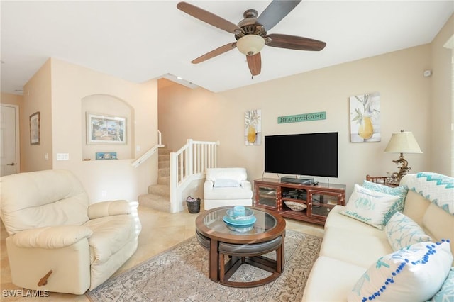 tiled living room with ceiling fan