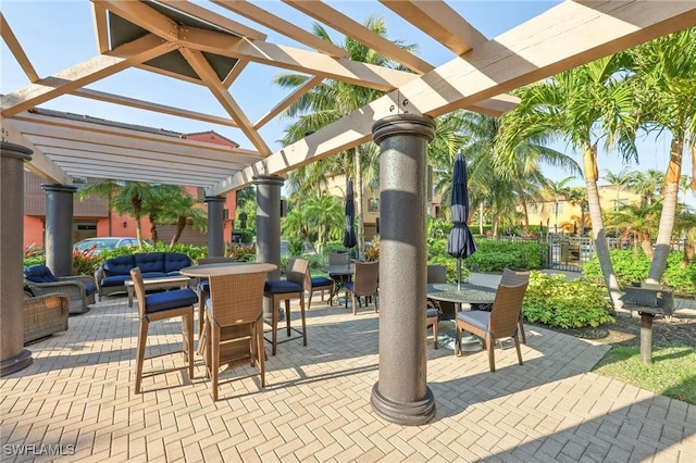 9067 Capistrano St N Unit 4502, Naples, FL 34113 - view of patio / terrace with an outdoor living space and a pergola