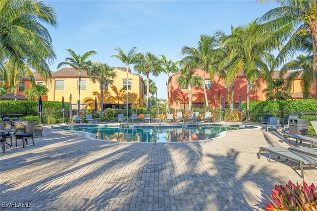 9067 Capistrano St N Unit 4502, Naples, FL 34113 - view of swimming pool featuring a patio area