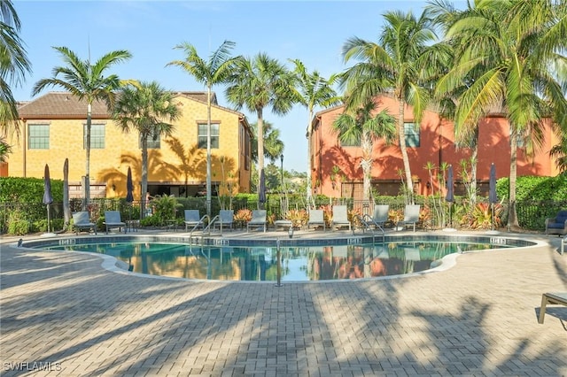 9067 Capistrano St N Unit 4502, Naples, FL 34113 - view of swimming pool with a patio area