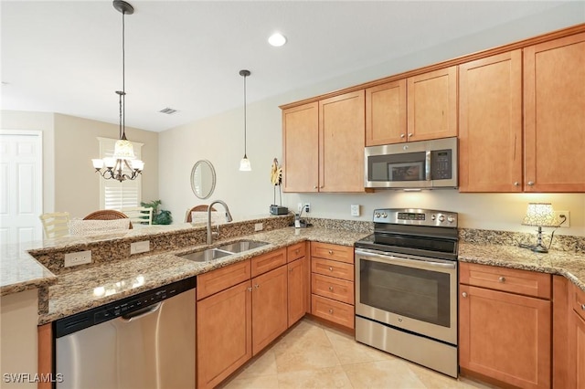 9067 Capistrano St N Unit 4502, Naples, FL 34113 - kitchen with pendant lighting, an inviting chandelier, sink, light stone countertops, and appliances with stainless steel finishes