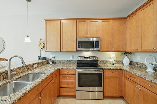 9067 Capistrano St N Unit 4502, Naples, FL 34113 - kitchen featuring light stone countertops, sink, pendant lighting, and appliances with stainless steel finishes