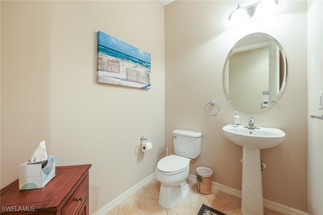 9067 Capistrano St N Unit 4502, Naples, FL 34113 - bathroom featuring toilet, tile patterned floors, and sink