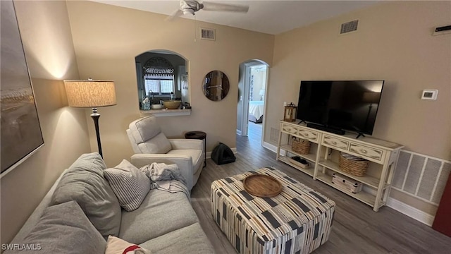 living room with ceiling fan and wood-type flooring