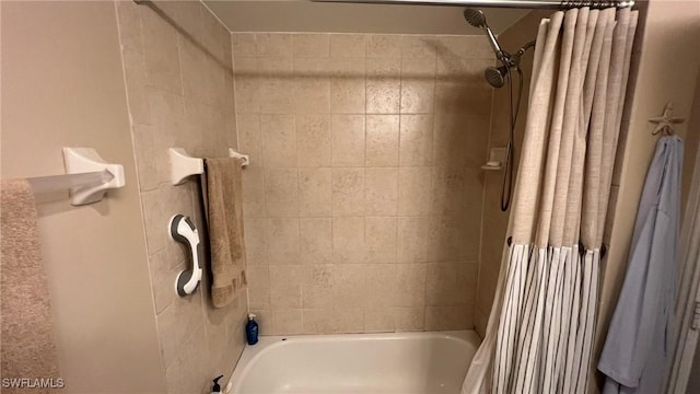 bathroom with shower / bath combo with shower curtain