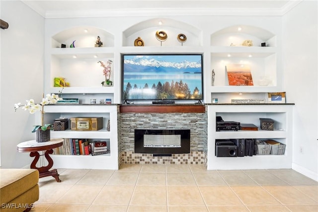 bar featuring a tile fireplace, tile patterned floors, built in shelves, and crown molding