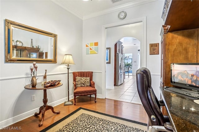 office with crown molding and light tile patterned floors