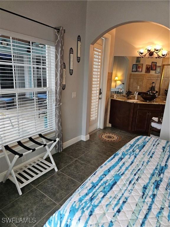 bedroom with dark tile patterned flooring