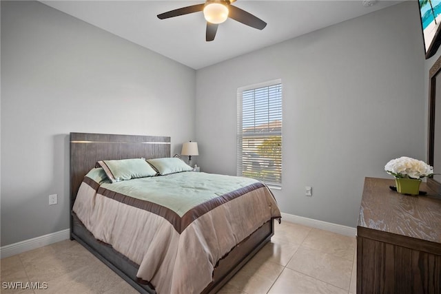 bedroom featuring ceiling fan and light tile patterned flooring