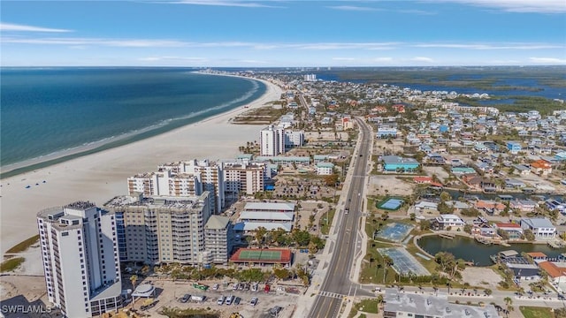 birds eye view of property with a view of the beach and a water view