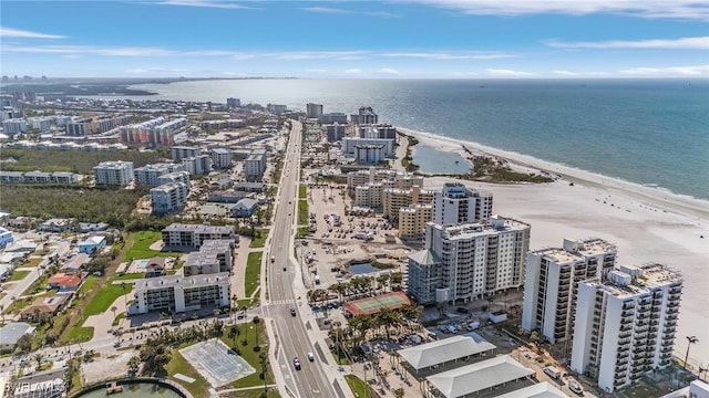 birds eye view of property with a view of the beach and a water view