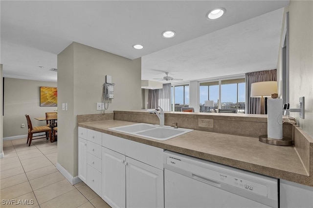 kitchen with ceiling fan, dishwasher, sink, light tile patterned floors, and white cabinets