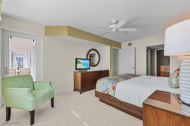 bedroom featuring ceiling fan and light carpet