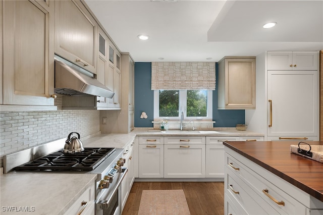 kitchen with white cabinetry, stainless steel range, tasteful backsplash, dark hardwood / wood-style flooring, and wooden counters