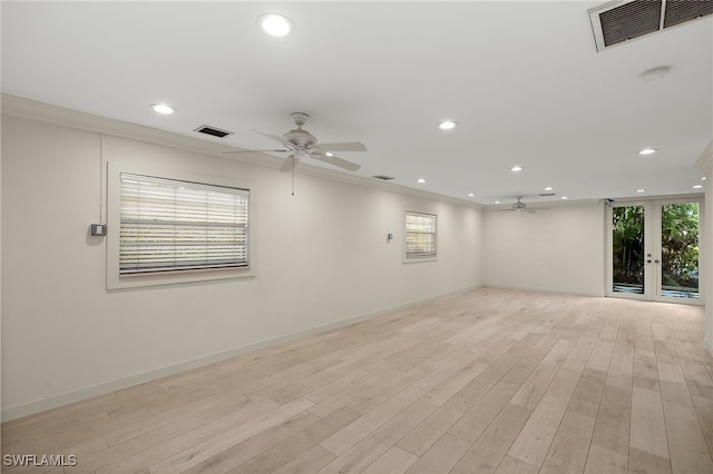 unfurnished room featuring light hardwood / wood-style flooring, plenty of natural light, and ceiling fan