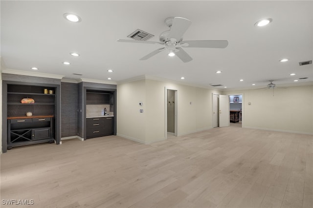 unfurnished living room featuring ceiling fan, crown molding, and light hardwood / wood-style floors