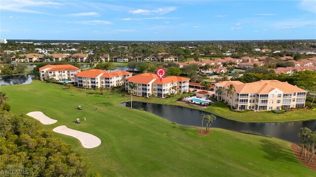 drone / aerial view featuring a water view and golf course view