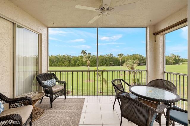 sunroom / solarium with ceiling fan