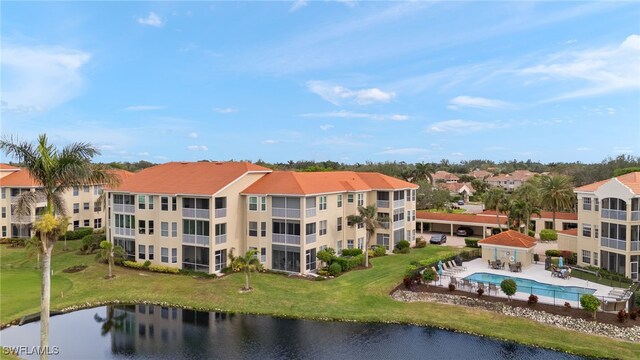 birds eye view of property featuring a water view