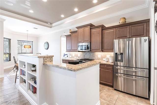 kitchen with decorative backsplash, light stone countertops, light tile patterned floors, a kitchen island, and stainless steel appliances