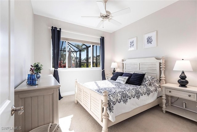 bedroom with ceiling fan and light colored carpet