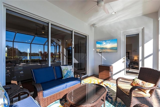 view of patio with a lanai, an outdoor living space, and ceiling fan