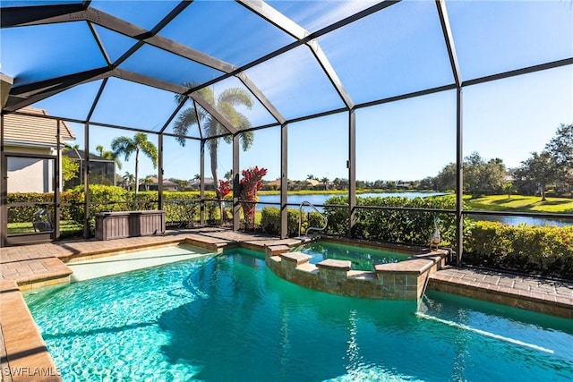 view of swimming pool featuring glass enclosure and a water view