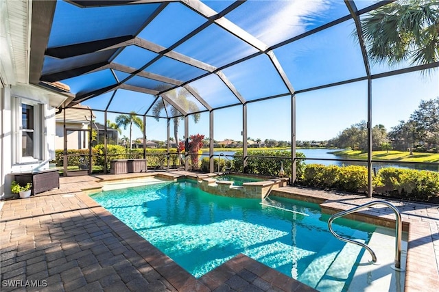 view of pool featuring glass enclosure, an in ground hot tub, a patio area, and a water view